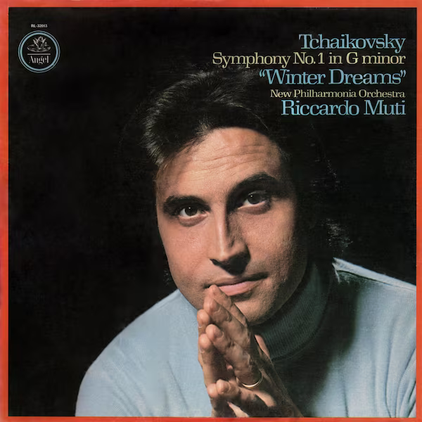Riccardo Muti stands in front of a black background. His hands together in front of his chin. The cover is surrounded by a red border.