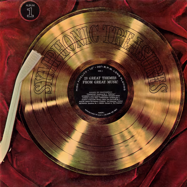 A gold record disc rests on top of red velvet fabric. A white tone-arm rests atop the disc.